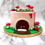 Taken straight out of a fairytale, this mushroom fairy house cake will house some delicious magic for your birthday celebrations. The design of this fairy mushroom house cake will remind your little one of the same bedtime stories that bring them immense comfort and joy. 
