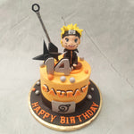 This black ribbon has the metal placard with the leaf symbol on it, which looks as if it's the Genin headband.  This Naruto birthday cake design also features a miniature figurine of Naruto Uzumaki himself alongside a life-sized shuriken and kunai knife
