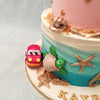 The top tier of this animal theme 1st birthday cake is a pure pastel pink dream with gold stars accenting it all over. An elephant, bear and koala can be spotted as this one year birthday cake's topper. Behind which is a gorgeous three-dimensional rainbow, representative of hope and new beginnings.