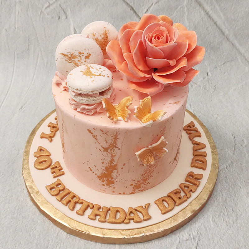 This peach rose cake is a floral sensation made to bring to life delicate sentiments and tones of beauty and passion. This  peach floral cake design brings a feminine aesthetic to the table and highlights the artistry of nature.
