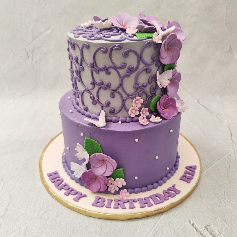 This purple engagement cake is a sure-fire way to engage all the senses of your entire guest list. With flavours as captivating as the visuals on this engagement 2 tier cake design, this piece will be  one of the most memorable parts of the celebrations.