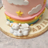  Nestled into a rainbow coloured basket on top and happily asleep on a fluffy, white cloud near the base are two, miniature, toy-like unicorns around which this unicorn and rainbow cake is themed.
