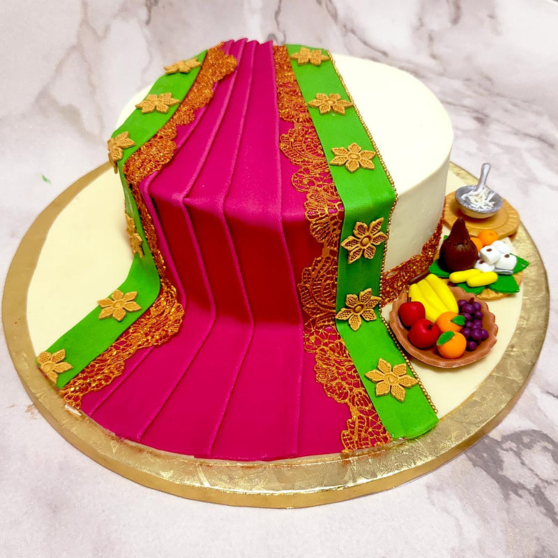  This saree cake is the perfect edible representation of this cultural heirloom which has been around for thousands of years. This saree theme cake would help weave together an ideal celebration for any woman in your life who is a big fan of this gorgeous garment. 