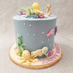 The aquatic theme of this sea animals cake emerges through the smooth, blue buttercream pattern that frosts the base like the calming wash of the sea. The sea creature cake ideas come inspired by all the enchantment of an aquarium with the mystery of the sea.