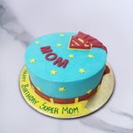On top of this super mom theme cake is the iconic 'S' symbol popularly worn on the chest of Superman and a small, red cape that falls behind it.  With this birthday cake for super mom, it almost looks like her costume has been left behind on display to be savoured.