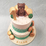 Adorned from top to bottom with delicious, golden-coloured macarons, this teddy bear theme cake acts as a dessert platter for this gourmet pastry made from ground almonds and sugar to be perfectly crisp on the outside and buttery-smooth and creamy-silky on the inside. 