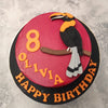 With a tropical touch to it, this Toucan theme cake features a rich, red base and beautiful black toucan with an orange head and white feathered tail sitting perched on a tree branch. 
