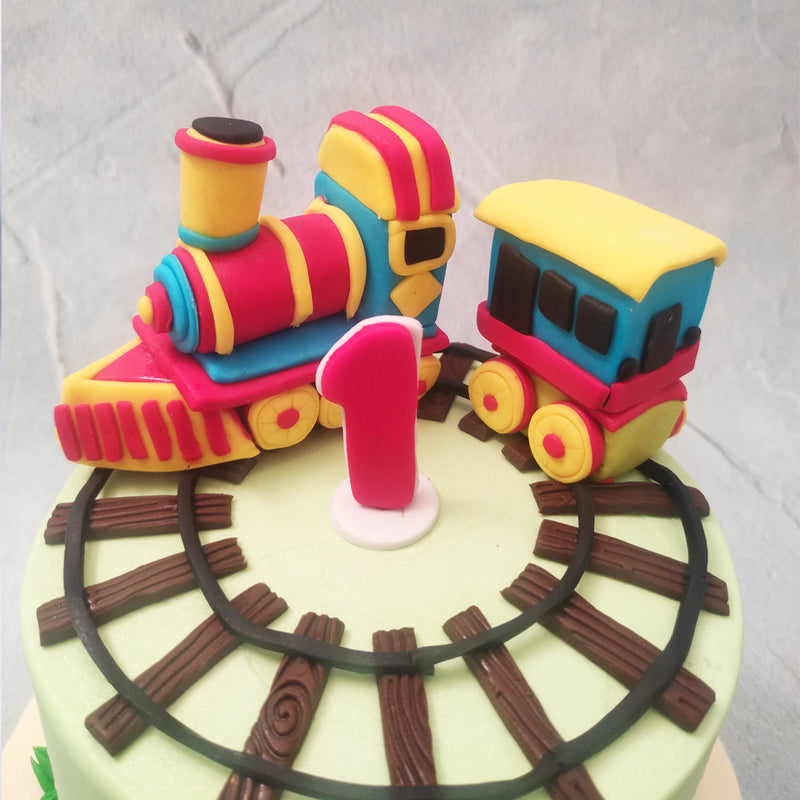 Train theme cakes have become popular because from a historical point of view, trains were the first medium of bringing people together, similarly a toy train cake design like this would be a great addition to your birthday cake for kids as birthdays are also a celebratory way of bringing people together.