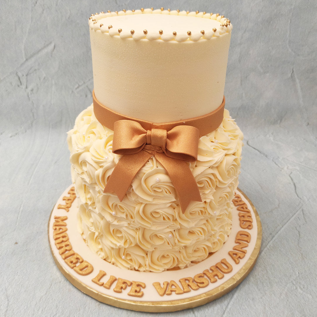 UG Cakes - simple two tier Rosette Cake. 💟 #weddingcake... | Facebook