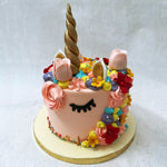 This unicorn cake pink was crafted to serve up some fairytale magic on a golden platter in real life.