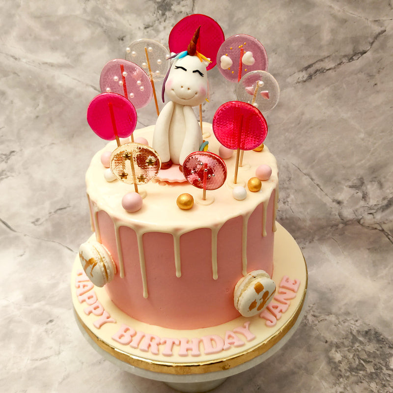 Bring in the joy of turning a year older with this fantastical timeless piece that'll bring a smile to your child's face in the form of a unicorn lollipop cake. This unicorn cake with lollipop is here to lift your spirits and light up your celebrations!