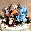 This woodland theme birthday cake for kids is then further garnished with edible leaves and broken bits of chocolate that look like barks, crumbs of cake that look like mud and edible leaves. 