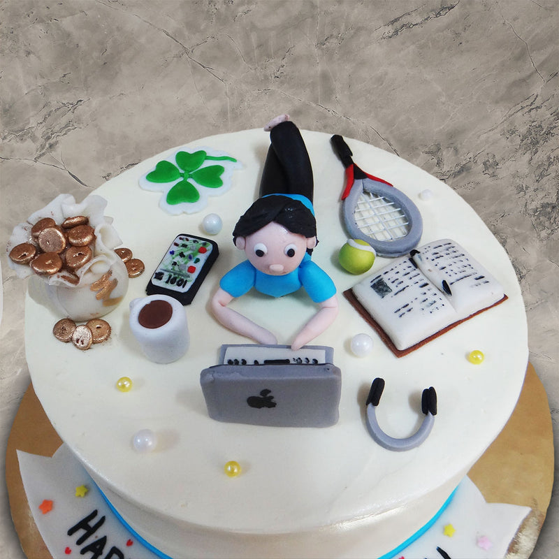 The glossy white base and cover of the work from home theme cake for him makes the details on the cake pop up and the intense expression on the workaholic husband/dad is apt for the occasion..