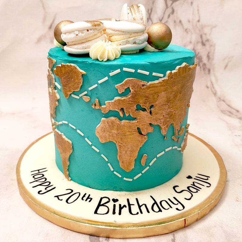  On a tall teal blue base, this world map cake decoration includes a globe-like representation of the entire world in a lustrous gold shade, surrounded by white trail lines all over.